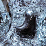 Black Leather Ankle Boots Featuring Stylish Wedge Heel Design