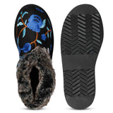 Suede leather snug boots with vibrant blue floral embroidery by Saint Clarisse