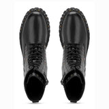 Sleek and edgy SAINT NATALIE boots with metal studs, lace-up design, and high ankle for a stylish look