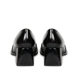Step into luxury: Saint Mirielle's black patent leather moccasins - handcrafted perfection